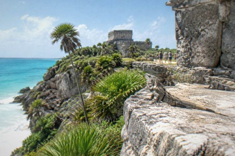 Tulum's clifftop Maya ruins above turquoise water, paired with a nearby cenote swim stop